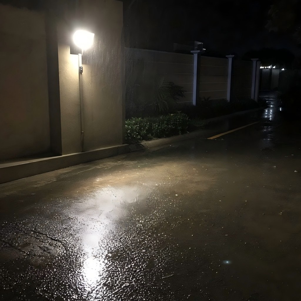 Floodlight installed near wet pavement after heavy rain